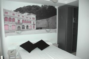 Ένα ή περισσότερα κρεβάτια σε δωμάτιο στο Pensión Koxka