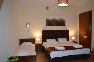Кровать или кровати в номере Tbilisi Apartment 2