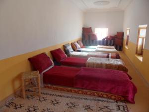 Uma cama ou camas num quarto em Gite Tigmi Azrur