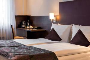 Cama ou camas em um quarto em Mercure Frankfurt City Messe