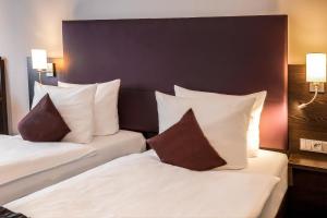 Cama ou camas em um quarto em Mercure Frankfurt City Messe