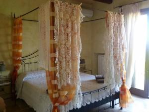 Postel nebo postele na pokoji v ubytování Masseria Le Terrazze di Serranova