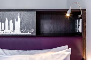 Cama ou camas em um quarto em Mercure Frankfurt City Messe