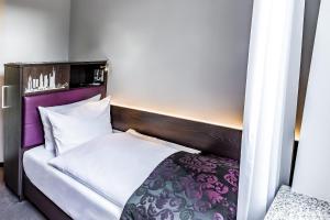 Cama ou camas em um quarto em Mercure Frankfurt City Messe