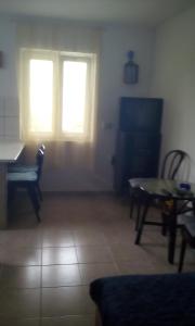 Televízia a/alebo spoločenská miestnosť v ubytovaní Apartment Neo + 18 fotografií