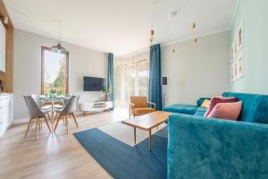 Televízia a/alebo spoločenská miestnosť v ubytovaní Apartamenty Sun & Snow Gdańsk Bursztynowa