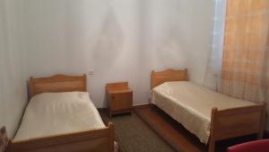 Ένα ή περισσότερα κρεβάτια σε δωμάτιο στο Firuza Hostel