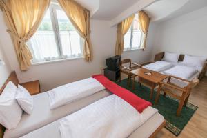 Postel nebo postele na pokoji v ubytování Hello Balcsi Apartmanház