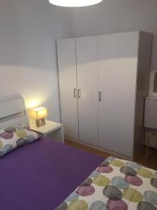 Postel nebo postele na pokoji v ubytování Apartments Ema
