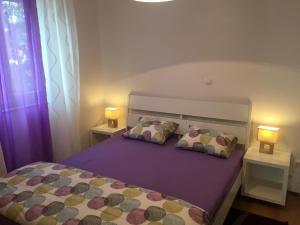 Postel nebo postele na pokoji v ubytování Apartments Ema