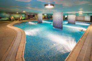 a large swimming pool in a hotel room at Boudl Al Woroud in Riyadh