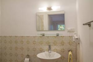 a bathroom with a sink and a mirror at Biohotel Spöktal in Bispingen