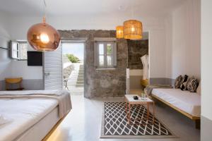Postel nebo postele na pokoji v ubytování Dreambox Mykonos Suites