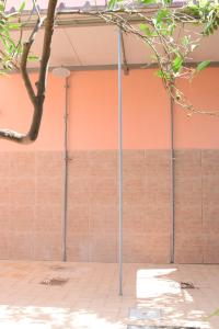 a building with metal poles in front of a wall at Stefy Home in Catania