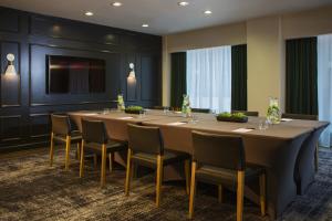 a conference room with a long table and chairs at Staypineapple, An Iconic Hotel, The Loop in Chicago