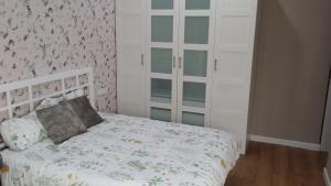 Posteľ alebo postele v izbe v ubytovaní DREAMSUITES MARIN GARCIA.