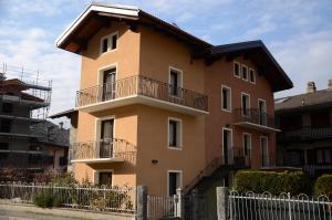 a building with balconies on the side of it at Maison Serendipity in Aymavilles