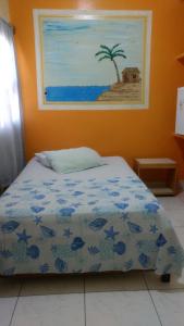 Un pat sau paturi într-o cameră la Pousada Ilha Bela