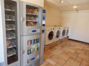 a laundry room with a washer and dryer at Winterton Suites in Williston