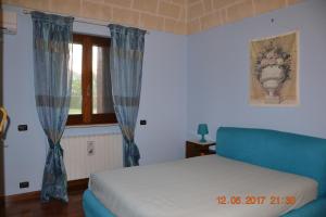 Postel nebo postele na pokoji v ubytování Masseria Fragnale