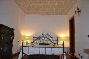 Postel nebo postele na pokoji v ubytování Masseria Fragnale