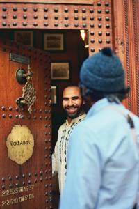 a man standing in front of a mirror at Riad Anata in Fez