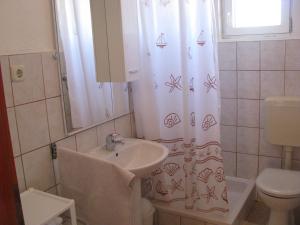 Koupelna v ubytování Apartments Šparada Mladen