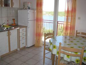 Kuchyň nebo kuchyňský kout v ubytování Apartments Šparada Mladen + 37 fotografií
