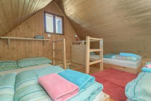Postel nebo postele na pokoji v ubytování Chalet Encijan - Velika planina