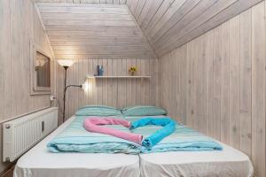 Tempat tidur dalam kamar di Chalet Pehta Velika Planina