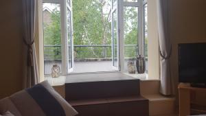 a window with a bench in front of it at Coiribe House B&SelfBreakfast in Galway