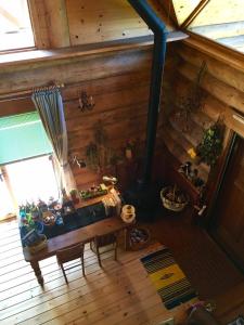 an overhead view of a room with a stove in a cabin at Deja vu in Shika