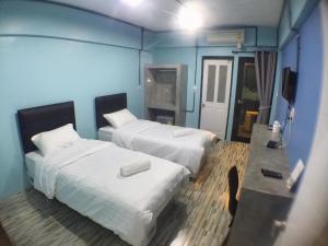 En eller flere senge i et værelse på JB Place