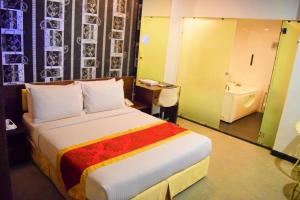 Postel nebo postele na pokoji v ubytování Springz Hotel-Bukit Jalil