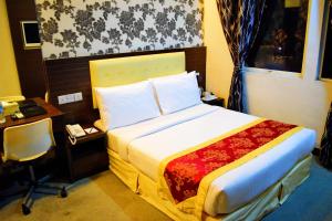 Voodi või voodid majutusasutuse Springz Hotel-Bukit Jalil toas