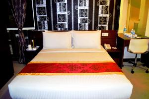 Voodi või voodid majutusasutuse Springz Hotel-Bukit Jalil toas
