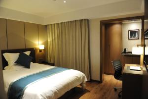 Cama o camas de una habitación en Atour X Hotel Shanghai Hongqiao Airport Konggang Road
