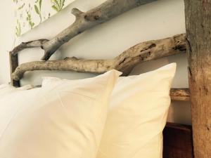 Una cama o camas en una habitación de il Piccolo Polpo Hotel