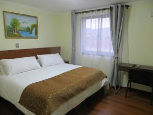 Ein Bett oder Betten in einem Zimmer der Unterkunft Hotel Newen
