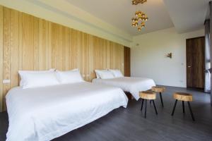 Krevet ili kreveti u jedinici u okviru objekta Qi Li Xiang Homestay