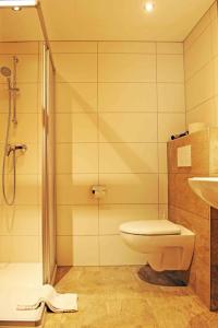 Kúpeľňa v ubytovaní Pension Olympia