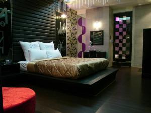 Rúm í herbergi á Sexy City Motel