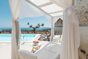 a white tent with a view of a pool at Villa Aria in Agios Nikolaos