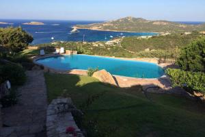 a swimming pool with a view of the ocean at Paradiso in Costa Smeralda in Porto Cervo