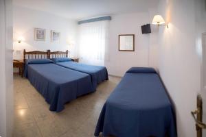 Posteľ alebo postele v izbe v ubytovaní L´Hostalet