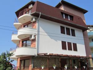 a building with balconies on the side of it at House Sofia in Sveti Vlas +11 photos