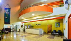 a lobby with a reception desk in a building at Inventree Hotel Pune in Pune