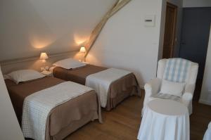 Ένα ή περισσότερα κρεβάτια σε δωμάτιο στο Côte d'Opale - La Ferme des Saules