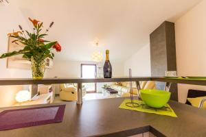 a kitchen with a counter with a green bowl on a table at Apartment Ruby in Pula