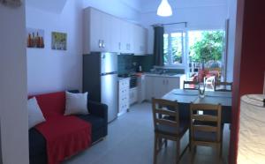 A kitchen or kitchenette at Mirtos Apartments
